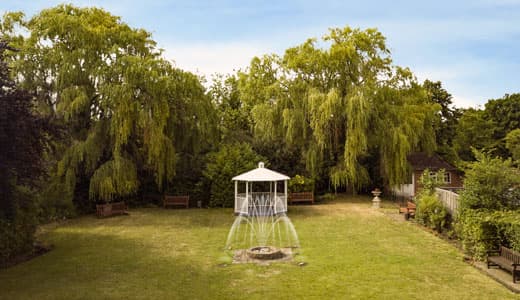 The Secret Garden, manicured lawns and a classic fountain