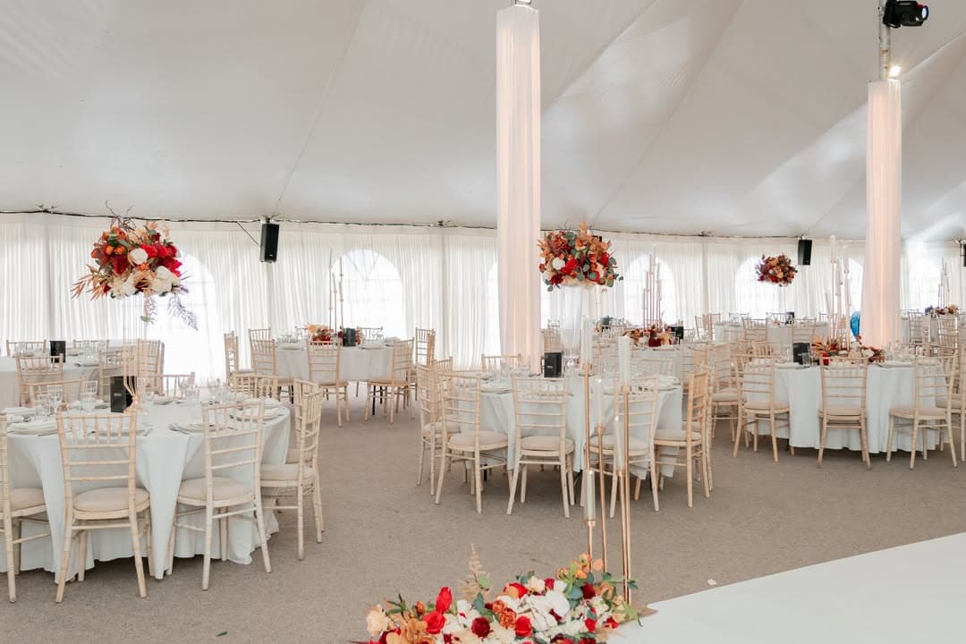 The marquee dressed with florals and soft uplighting