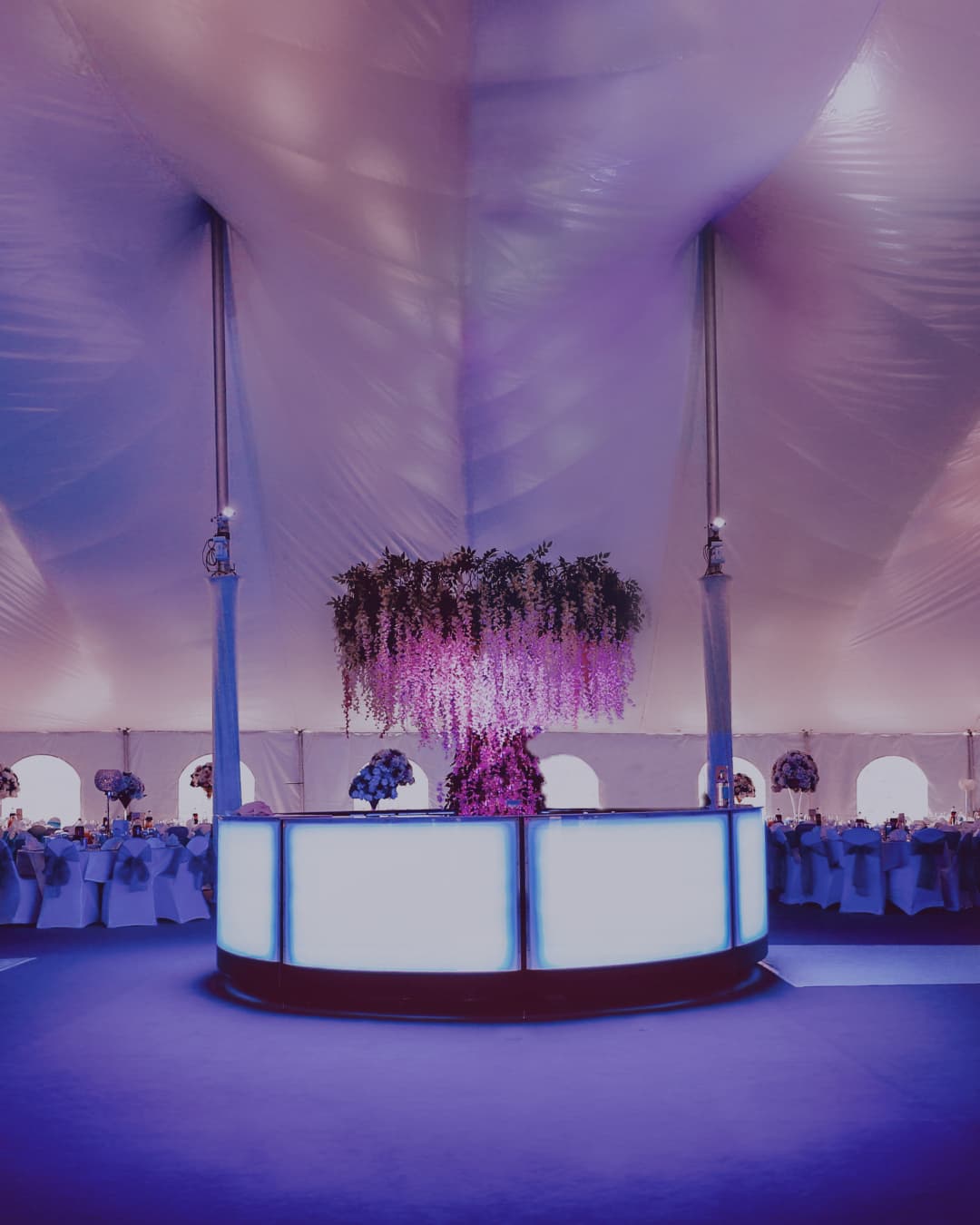A wedding reception beneath the white canopy ceiling