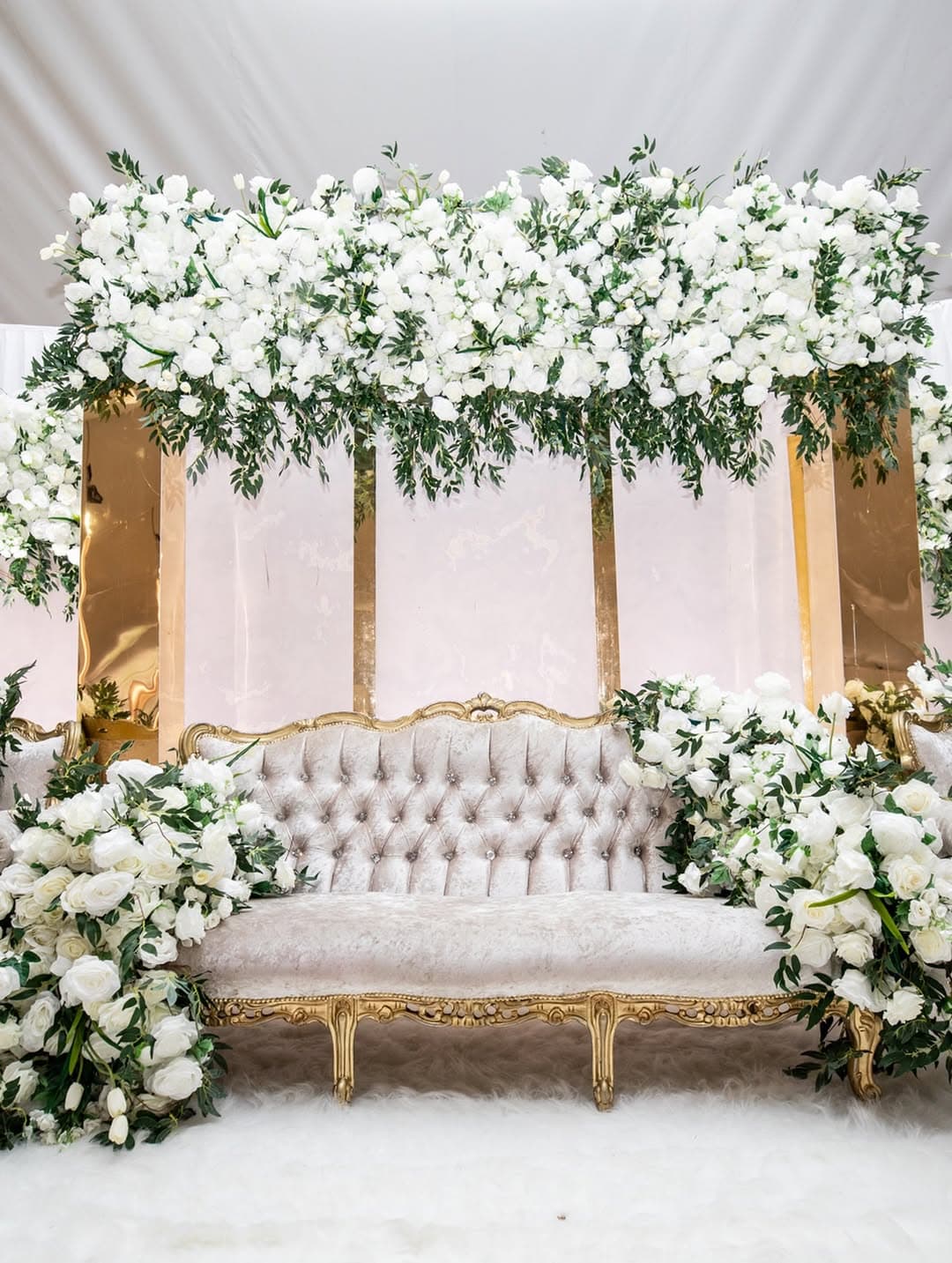 Wedding table styling beneath the marquee's white canopy