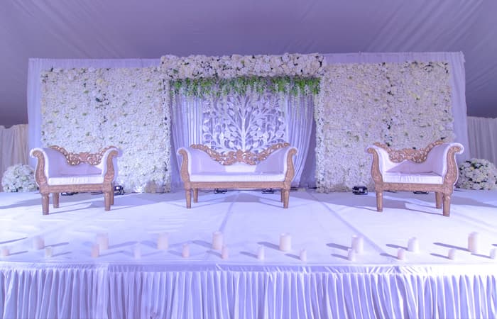 A traditional mandap dressed for a faith-based wedding ceremony