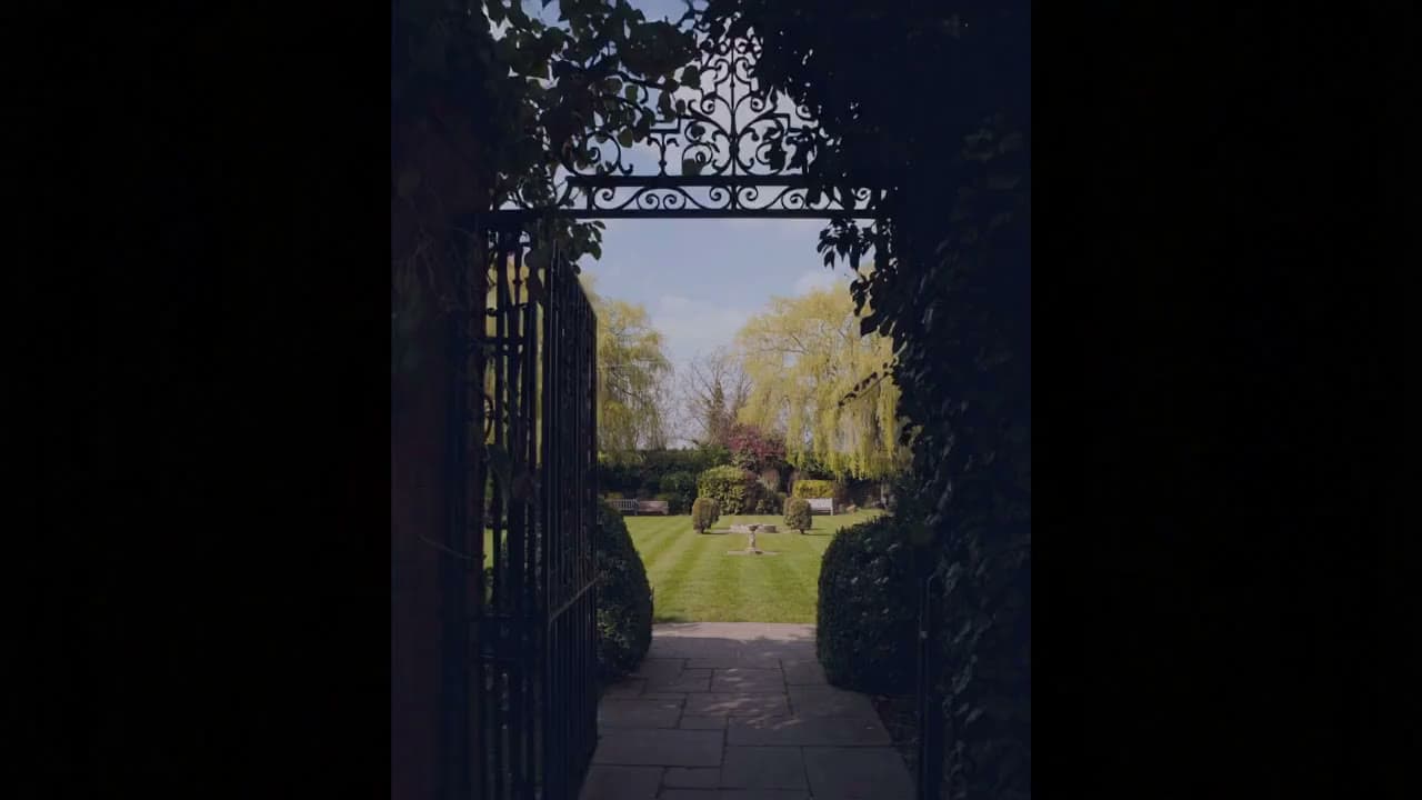 A blossom-lined avenue through the estate grounds in spring
